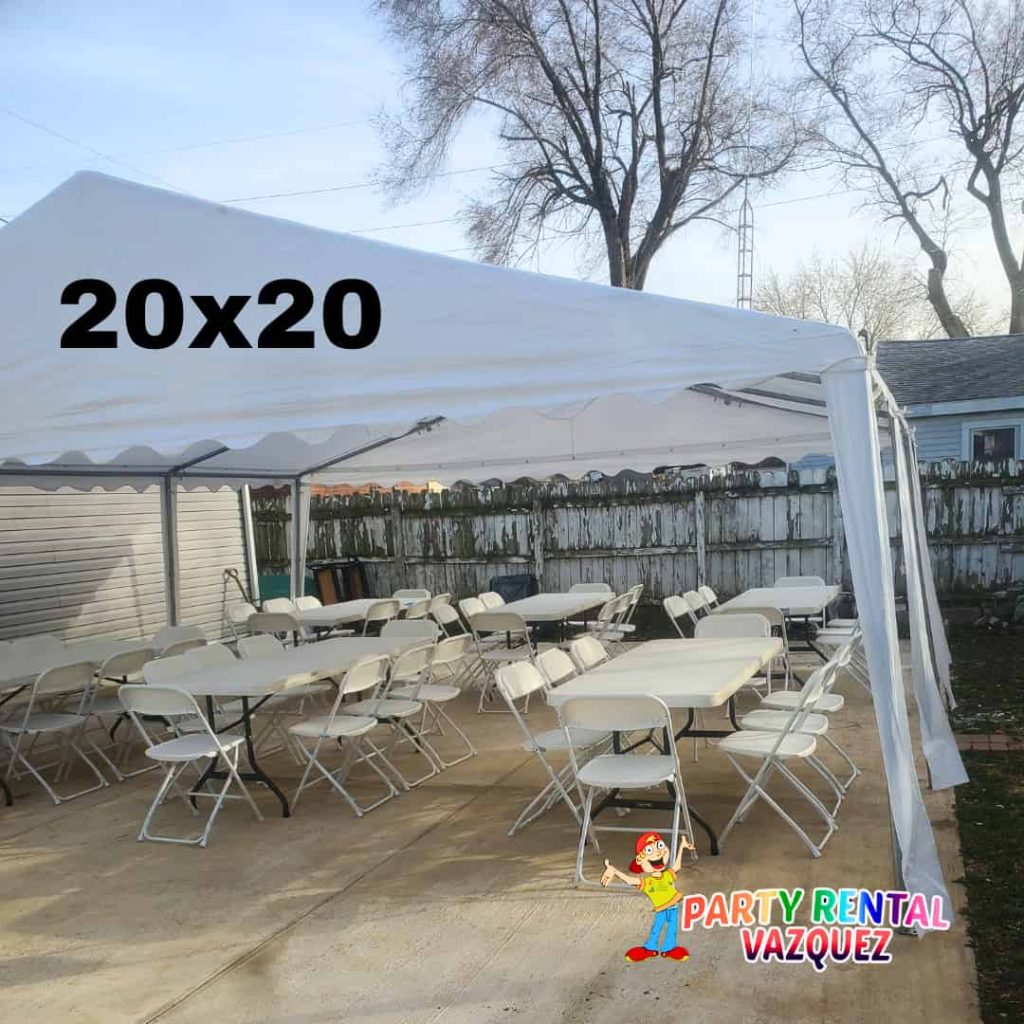 White 20x20 PE party tent rental with rectangular tables and chairs in Columbus, Indiana by Party Rental Vazquez for birthdays, graduations and outdoor celebrations.