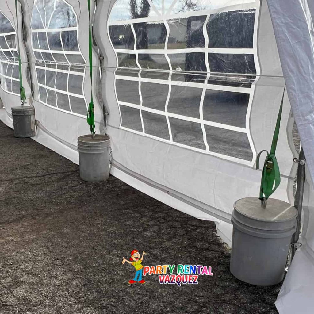 Heavy-duty concrete blocks used to securely anchor a 20x20 PE party tent on concrete for weddings and special events in Columbus, Indiana.